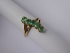 A Lady's 14 ct Yellow Gold and Emerald Five Stone Ring, approx 1.65 cts of oval emeralds, size P,