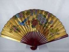 A Large Hand Painted Chinese Fan, the fan hand painted with exotic birds.