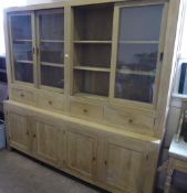 A Generously Proportioned Bespoke Oak Dresser, with four drawers and four cupboards, with glaze-