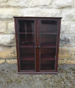 An Antique Victorian Mahogany Wall Cupboard, the cupboard having three shelves with pie crust