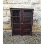 An Antique Victorian Mahogany Wall Cupboard, the cupboard having three shelves with pie crust