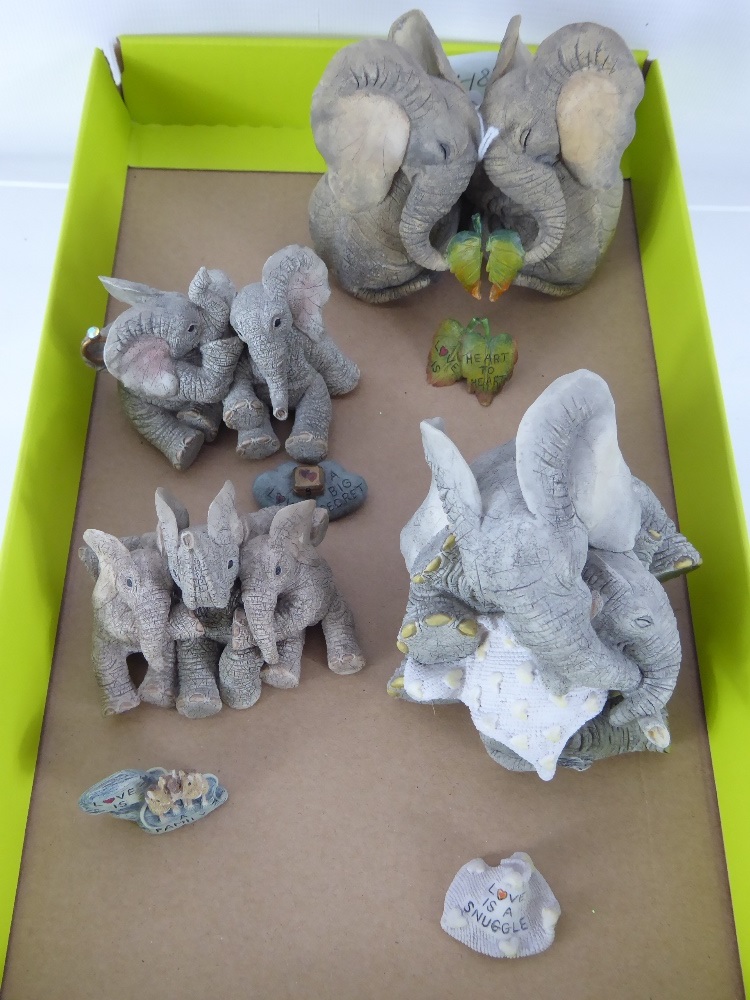 A Collection of Four Tuskers Elephants, with matching mini plaque, including "Love is a Big