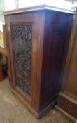 A Vintage Oak Carved Cupboard. The cupboard having two shelves with carved single door and