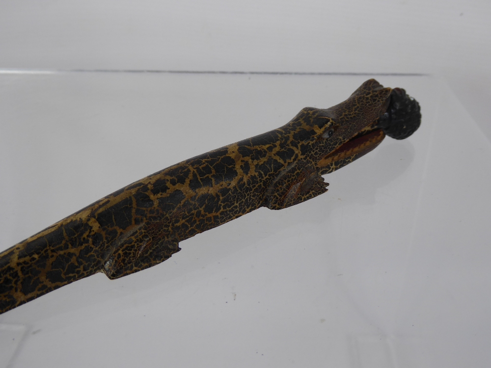 A Wood Carved Letter Opener, depicting a crocodile swallowing a man, approx 30 cms together with a