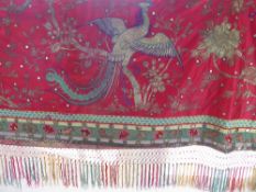 An Antique Chinese Silk Wall Panel, pomegranate silk embroidered with metal thread depicting