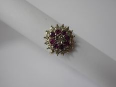 A 9ct Yellow Gold Diamond and Ruby Cluster Ring, 8 x 2.5 mm rubies, approx 17 pts of 8 cts dias,