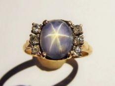 An Art Deco Natural Non-Heat Treated 3.78 ct Ceylon Cabachon Star Sapphire & Diamond Ring, the soft