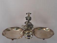 A Walker & Hall Silver Plated Berry Serving Dish, with an ornate handle, raised on ball feet.