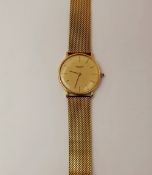 A Vintage Gentleman's Favre-Leuba Gold Plated Wrist Watch, having a gold coloured face with baton