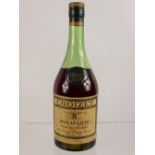 A Bottle of Fine Croizet Champagne Cognac, bottle dd 1914, 70 proof, wax shoulder button is intact.