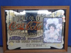 A Oak Framed Coco Cola Mirror, 'America's Favourite and the World, depicting a Victorian lady,