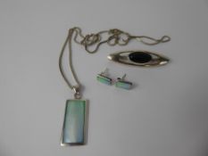 A Contemporary Silver and Green Stone Necklace, with matching earrings together with a silver cats