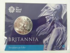 A Silver Britannia £50 Coin, in the original presentation slip.