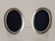 A Pair of Silver Oval Picture Frames, approx 11.5 x 8.5 cms.
