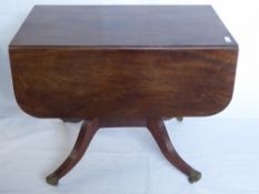 A Late Regency Mahogany Drop-Leaf Occasional Table, on reeded legs with casters, approx 117 x 92 x