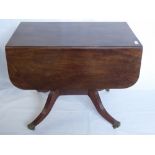 A Late Regency Mahogany Drop-Leaf Occasional Table, on reeded legs with casters, approx 117 x 92 x