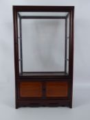 A Teak Display Cabinet, two internal glass shelves, twin cupboards beneath, approx 28 x 15 x 48