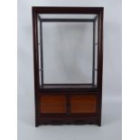 A Teak Display Cabinet, two internal glass shelves, twin cupboards beneath, approx 28 x 15 x 48