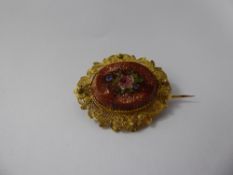 An 18 / 22 ct Oval Micro-Mosaic Brooch, depicting a rose, approx 16 x 22 mm, approx 6 gms.