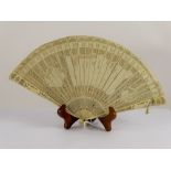 A Lady's 19th Century Delicate Ivory Brisé Fan, carved with classical figures to central