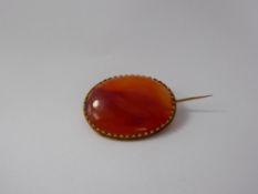 An 18 / 22 ct Orange Agate Brooch, the agate 31 x 26 mm, approx 8.3 gms