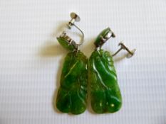 A Pair of Vintage White Gold and Carved Jade Earrings.