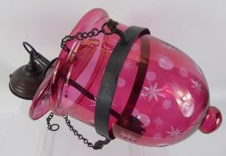 A Pair of Cranberry Glass Lantern Style Light Fittings, approx 24 x 47 x 19 cms.