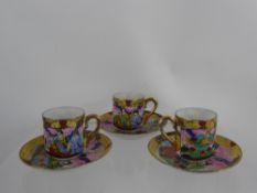 A Miniature Japanese Porcelain Tea Set, comprising ten teacups and saucers, depicting court