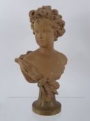 A Circa 1900 Plaster Bust of a Child. The bust having a terracotta finish and stamped to verso