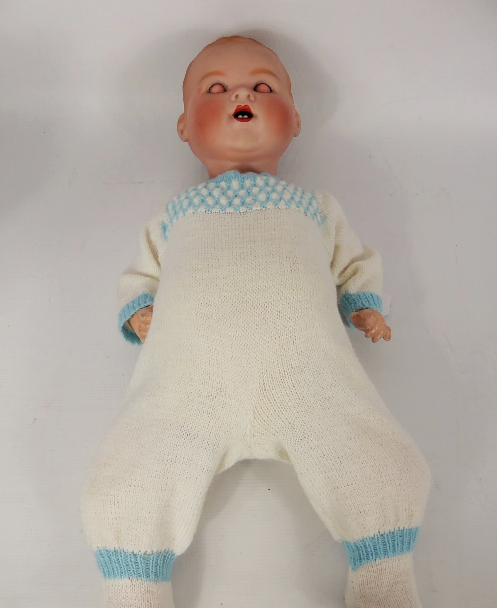 An Antique Armand Marseilles German Bisque-Headed Doll, blue sleeping eyes, open mouth revealing