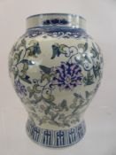 A Chinese Hand Painted Porcelain Vase, depicting pink and blue peonies, approx 21 cms high.