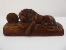 An Antique Wooden Carved Figure of a Lion, with Latin inscription to base, approx 13 cms.