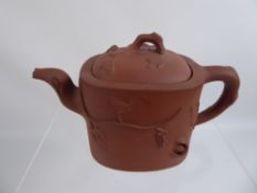 A Chinese Yixing Clay Tea Pot, with vine decoration, stamp to base.