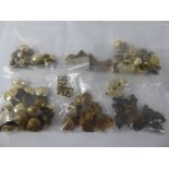 A Quantity of Brass Royal Engineers Military Accessories, including buttons and cap badges, pips