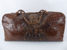 An Antique Crocodile Skin Gladstone Holdall Bag, approx 60 x 26 cms.