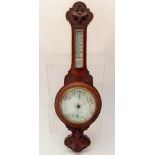 An Oak Cased Aneroid Barometer, approx 74 cms.