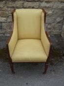 A Lady's Antique Empire Style Chair, with swept arms and decorative inlay, upholstered in primrose