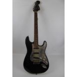 A Squire Stratocaster Black Electric Guitar, approx 100 cms.