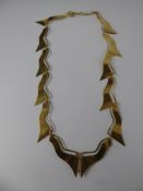A Lady's 9 ct Fancy Flame Form Necklace, approx 9 gms.