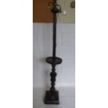 A Stained Oak Twin Lamp Stand, with decorative carving to centre column, aprox 170 cms high.