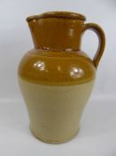 A Cream and Tan Porcelain Antique Pottery Water Jug, approx 36 cms high.