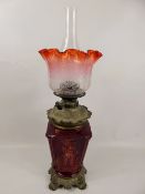 A Victorian Cranberry-Effect Oil Lamp, with etched glass shade, approx 50 cms