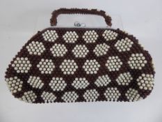 A 1960's Cream and Brown Beaded Handbag, with chrome clasp.