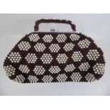 A 1960's Cream and Brown Beaded Handbag, with chrome clasp.