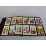An Album containing Donald McGill Humorous Seaside and Comic Post Cards, approx 80+.