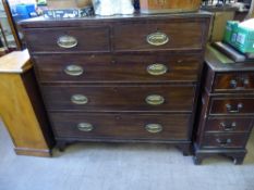 An Oak Plain-Fronted Chest of Drawers, with two short left and right to top and three graduated