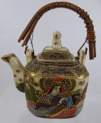 A Japanese Satsuma Tea Pot, with bamboo covered handle.