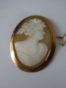 A 9 ct Shell Cameo Brooch, depicting a classical profile, on safety chain, approx 33 x 45 mm, approx