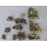 A Quantity of Brass Royal Engineers Military Accessories, including buttons and cap badges, pips