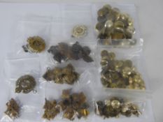 A Quantity of Brass Royal Engineers Military Accessories, including buttons and cap badges, pips